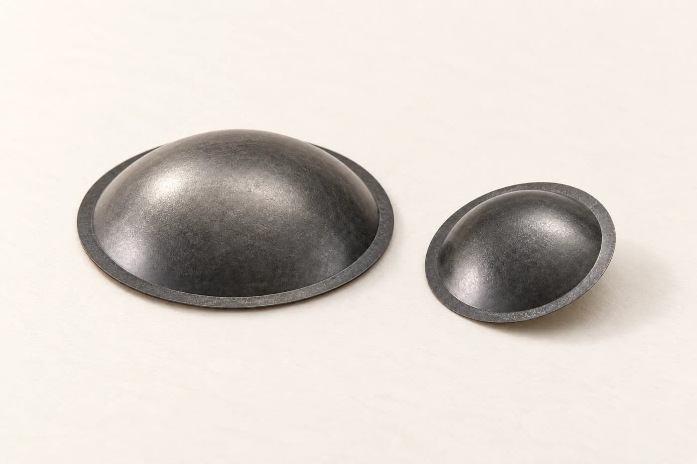 Two thin diamond tweeter domes with circular mounting rims